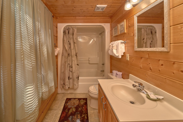 Bathroom with shower and tub at A Place to Remember, a 2 bedroom cabin rental located in Gatlinburg