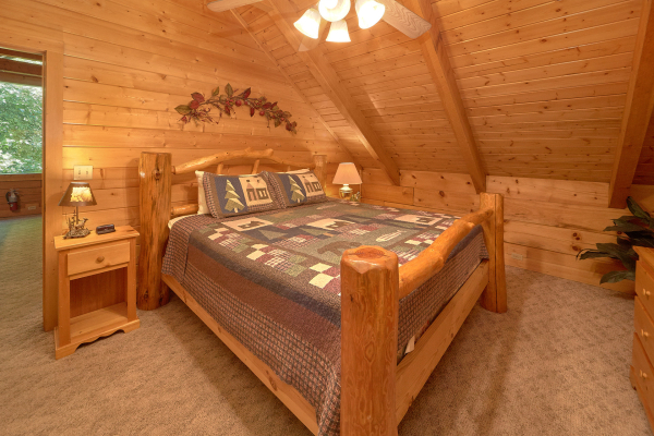 Log bed in a lofted room at A Place to Remember, a 2 bedroom cabin rental located in Gatlinburg