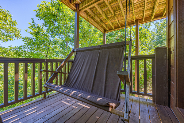 Cloth porch swing at Moonbeams & Cabin Dreams, a 3 bedroom cabin rental located in Pigeon Forge