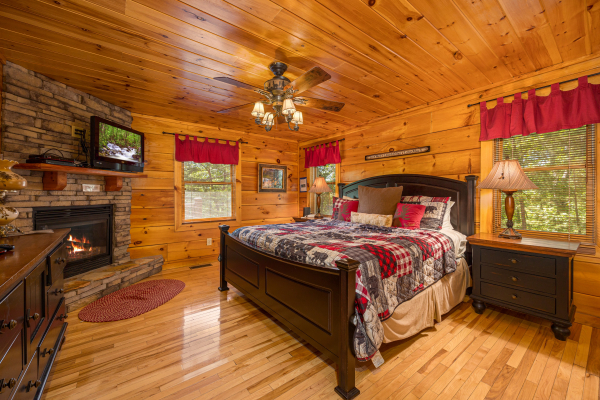 Fireplace in bedroom at Moonbeams & Cabin Dreams, a 3 bedroom cabin rental located in Pigeon Forge