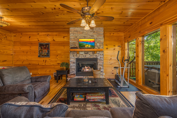 Sitting area and exercise bike at Moonbeams & Cabin Dreams, a 3 bedroom cabin rental located in Pigeon Forge