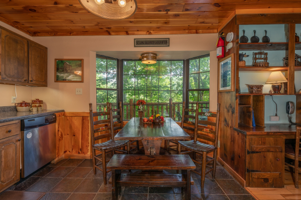 Dining table at Hidden Pleasure, a 1-bedroom cabin rental located in Gatlinburg