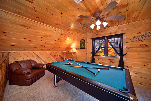 Pool table in the game room at Hidden Pleasure, a 1-bedroom cabin rental located in Gatlinburg