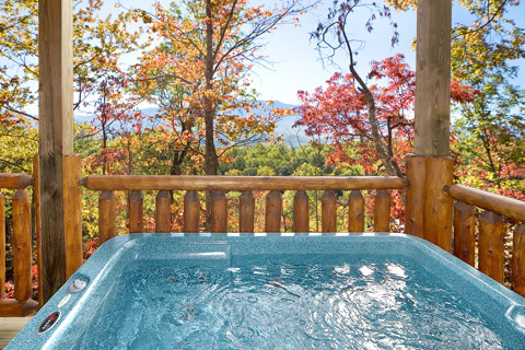 First floor deck with hot tub at Natural Wonder, a 4 bedroom cabin rental located in Gatlinburg