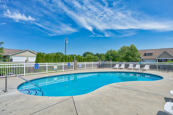 Pool with lounge chairs at A Pigeon Forge Retreat, a 2 bedroom cabin rental located in Pigeon Forge