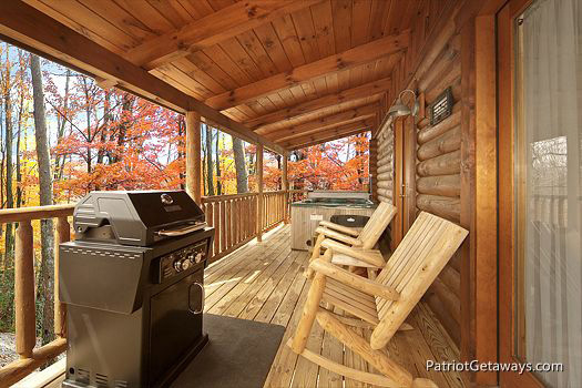 Chairs and grill on deck at A Lover's Secret a 1 bedroom cabin rental located in Gatlinburg