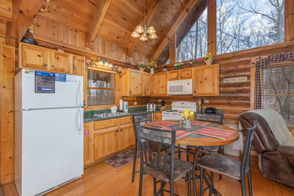 Kitchen and dining space at A Lover's Secret, a 1 bedroom cabin rental located in Gatlinburg