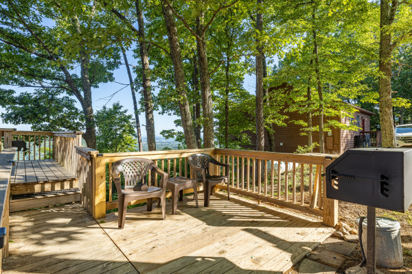 Grill and seating area at Cozy Mountain View, a 1 bedroom cabin rental located in Pigeon Forge