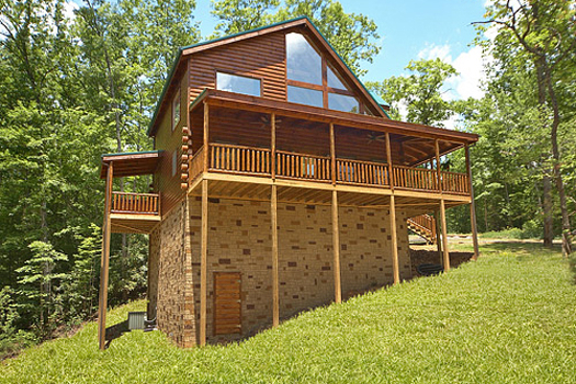Exterior back view at Pool House, a 2 bedroom cabin rental located in Gatlinburg