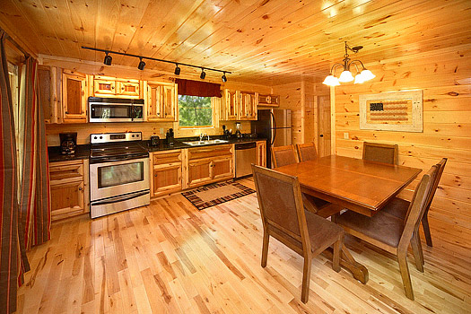 Kitchen and dining area at Pool House, a 2 bedroom cabin rental located in Gatlinburg