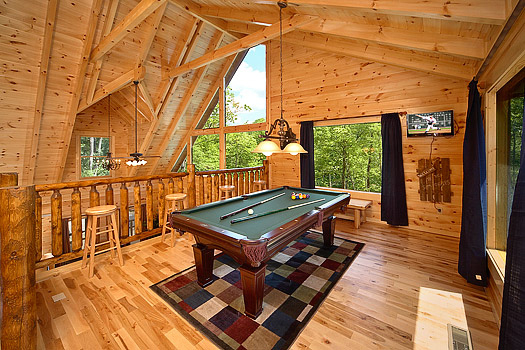 Lofted game room with pool table at Pool House, a 2 bedroom cabin rental located in Gatlinburg