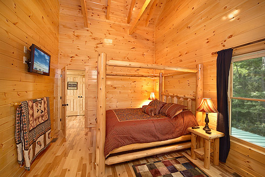 Second level bedroom with queen bed at Pool House, a 2 bedroom cabin rental located in Gatlinburg