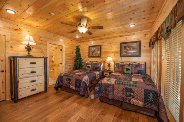 Bedroom with two beds and a dresser at Elk Horn Lodge, a 5 bedroom cabin rental located in Gatlinburg