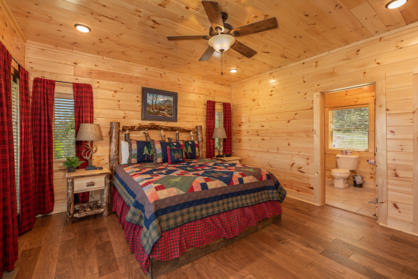 Bedroom with a king log bed at Elk Horn Lodge, a 5 bedroom cabin rental located in Gatlinburg