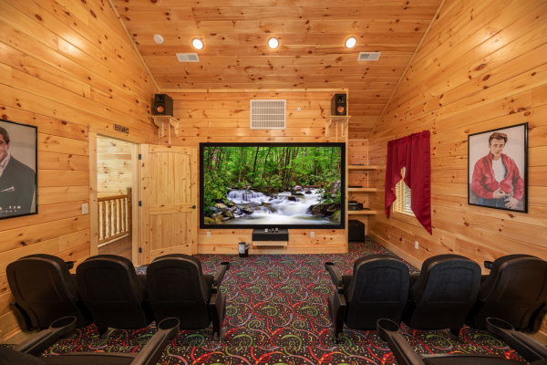 Theater room with stadium seating and large screen at Elk Horn Lodge, a 5 bedroom cabin rental located in Gatlinburg