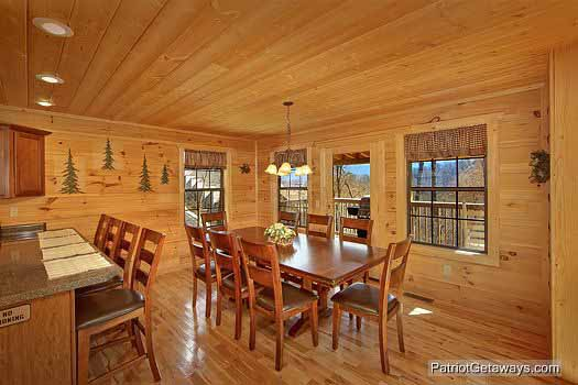 Dining table that seats eight at Alpine Pointe, a 5 bedroom cabin rental located in Gatlinburg