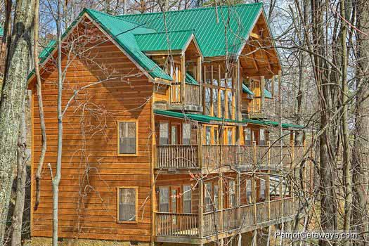 Exterior view of multiple levels of decks along the back of property named Alpine Pointe, a 5 bedroom cabin rental located in Gatlinburg