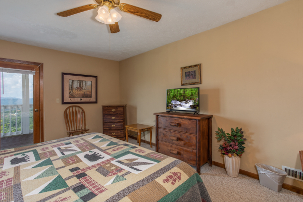 First bedroom with dressers and a television at Black Bear Ridge, a 3-bedroom cabin rental located in Pigeon Forge