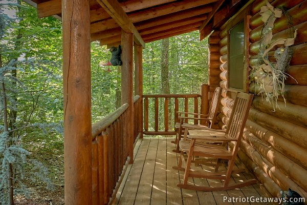 Rocking chairs on the front porch at A Bear's View, a 1 bedroom cabin rental located in Gatlinburg