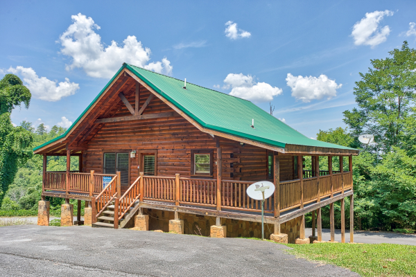 Looking at the cabin from the parking area at Majestic Sunrise, a 1 bedroom cabin rental located in Pigeon Forge