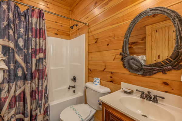 Bathroom with a tub and shower at God's Country, a 4 bedroom cabin rental located in Pigeon Forge