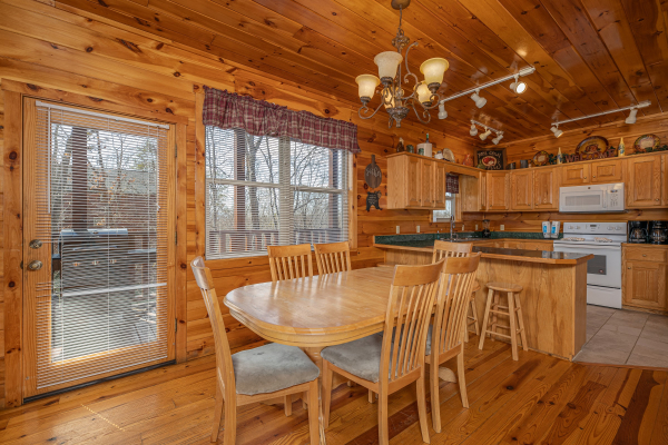 Dining table for six at Hickernut Lodge, a 5-bedroom cabin rental located in Pigeon Forge