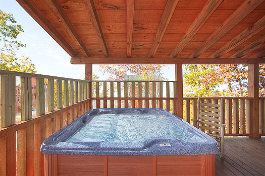Hot tub on deck at Hickernut Lodge, a 5-bedroom cabin rental located in Pigeon Forge