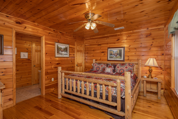 Bedroom with a log bed at Hickernut Lodge, a 5-bedroom cabin rental located in Pigeon Forge
