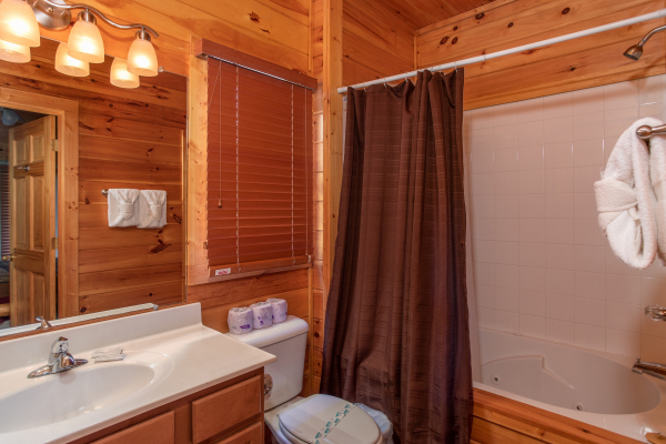 Bathroom with a tub and shower at Four Seasons Lodge, a 3-bedroom cabin rental located in Pigeon Forge